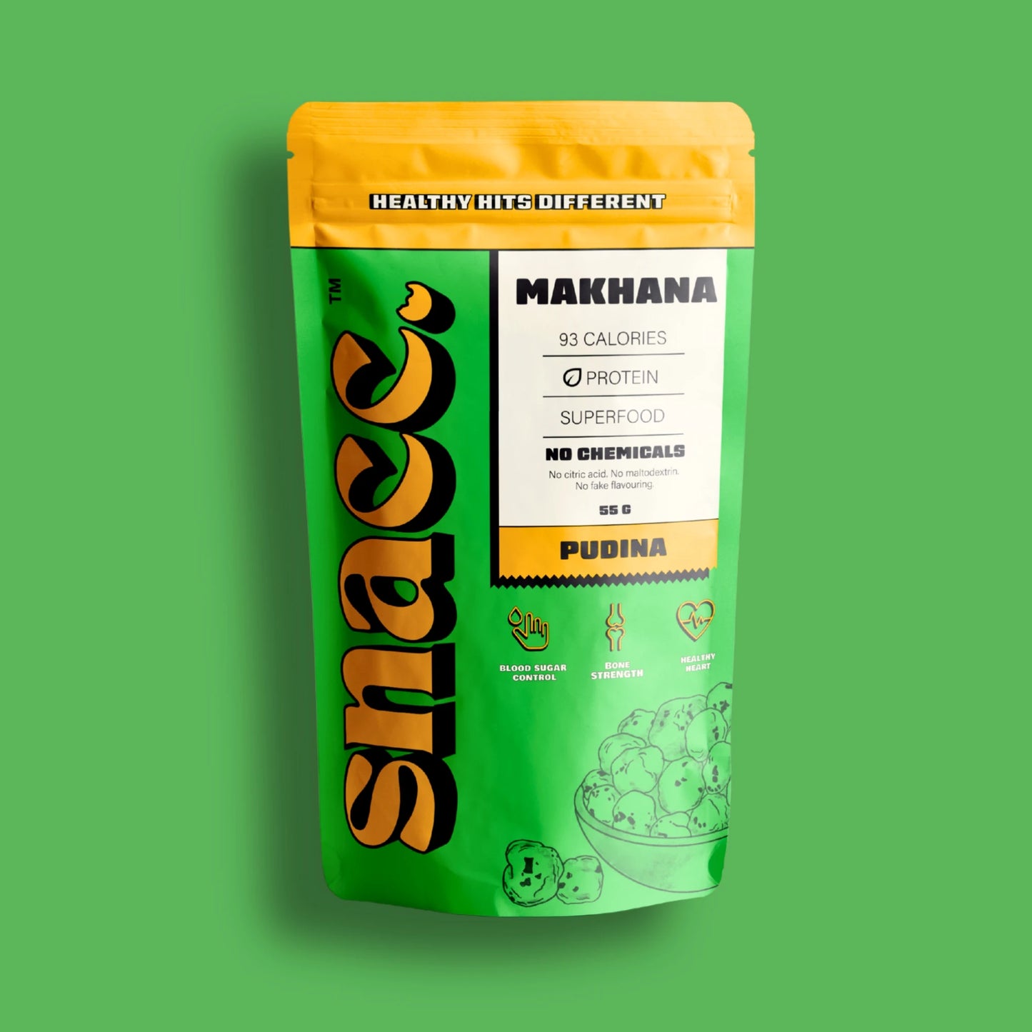 Green and yellow package of Makhana with Snacc branding on a green background